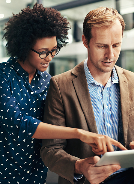 Man and woman reviewing salaries in current recruitment market