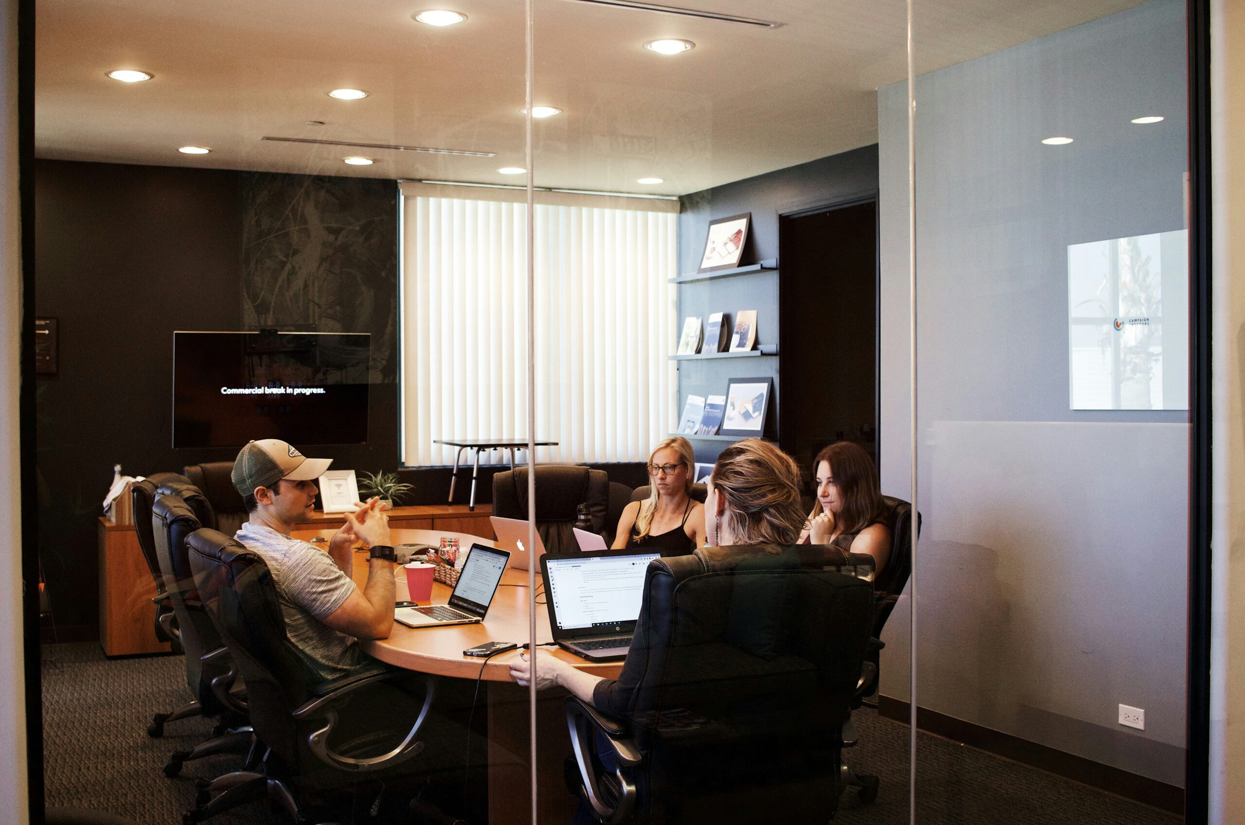 Photo of a work team meeting discussing recruitment KPIs