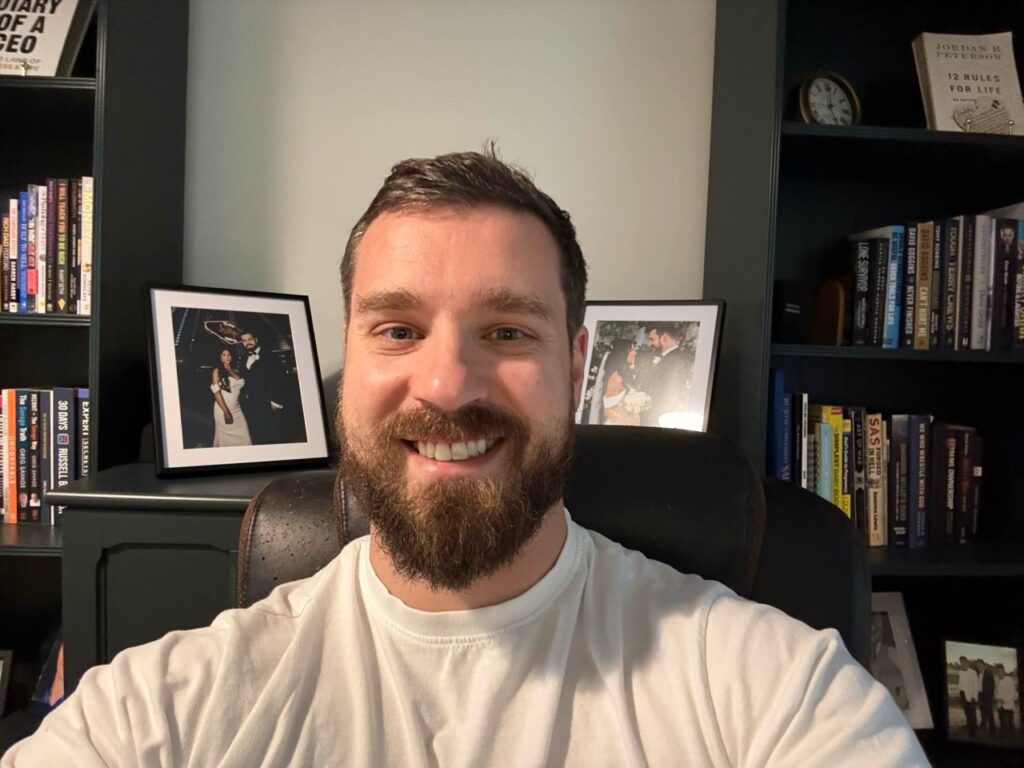 Smiling bearded man in a white top. David Revell is the co-founder and CEO of Charta Recruitment. Article for CharityJob on the use of videos in job applications