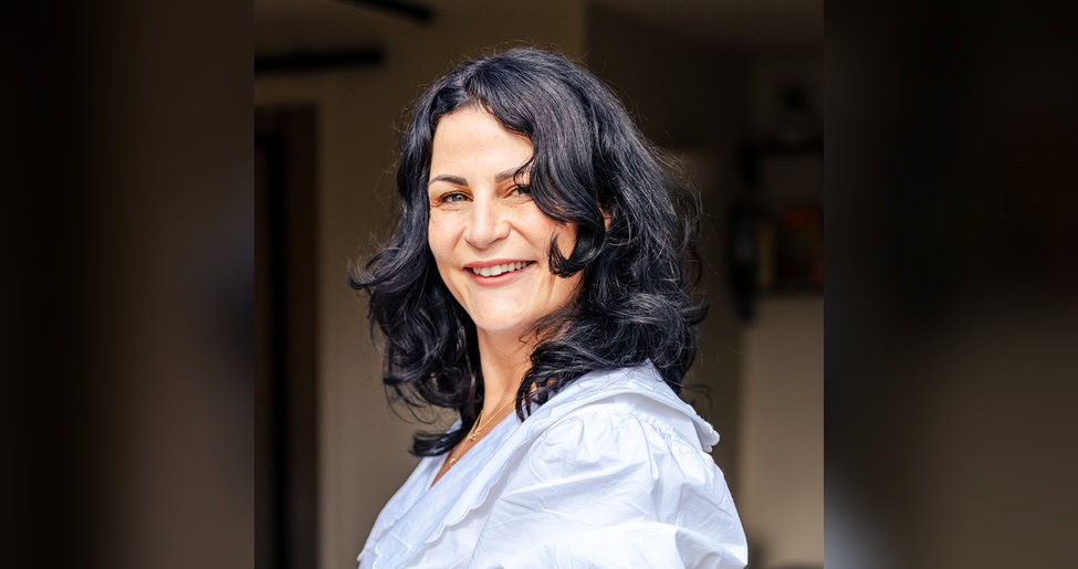Smiling woman with dark hair. Emma Thorp is an accredited coach and inclusion consultant. Article for CharityJob